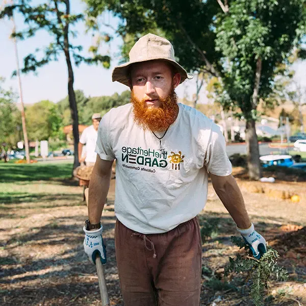 Male student working in the Heritage Garden